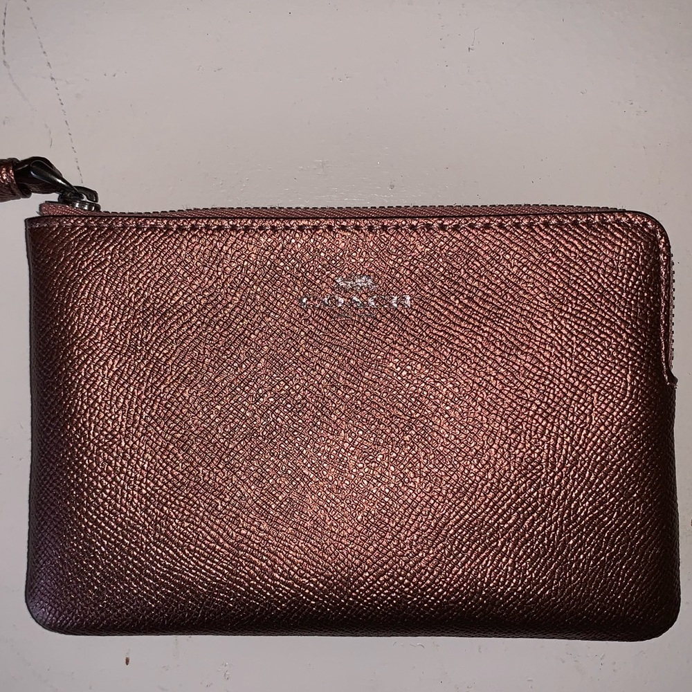 Pink metallic Coach wristlet